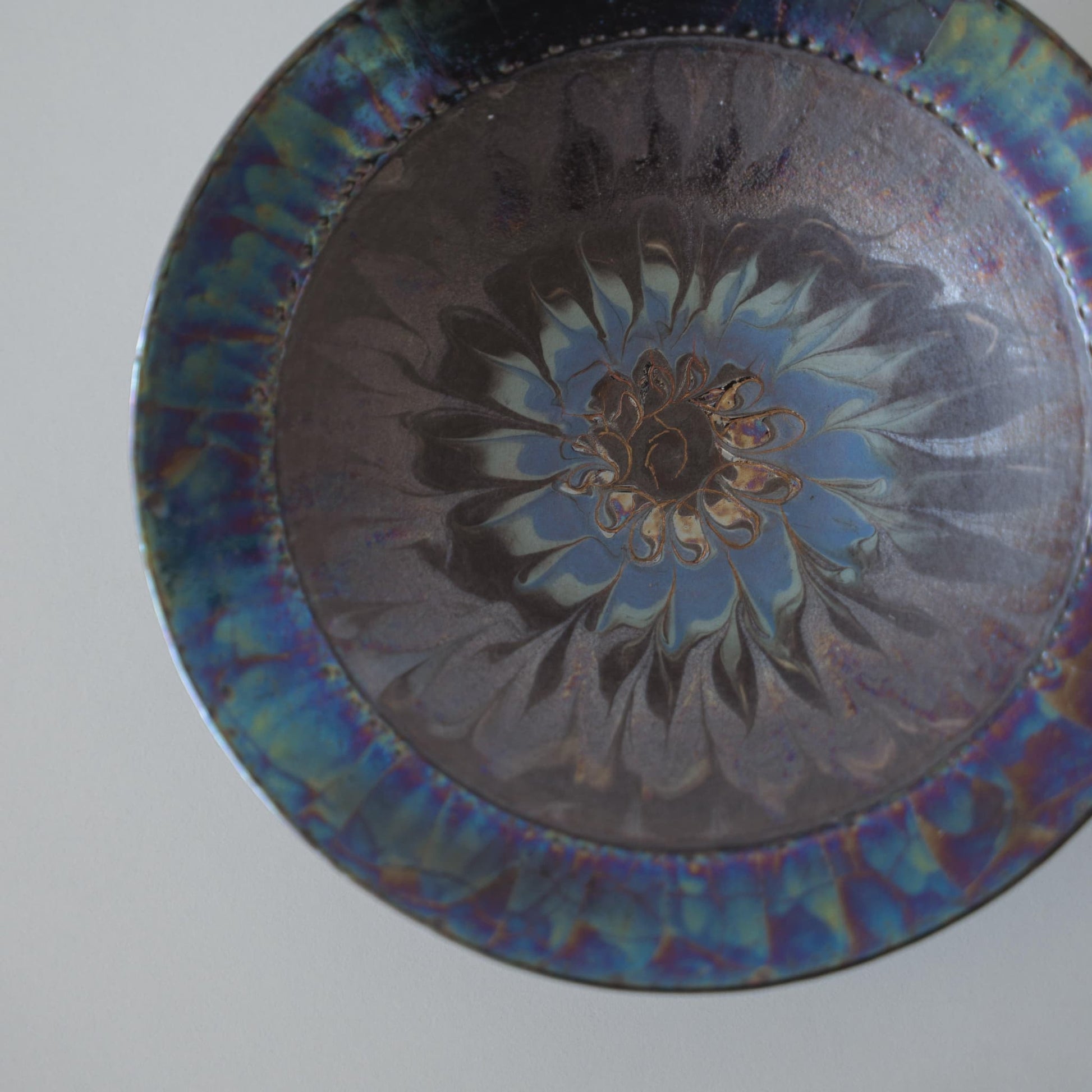 Overhead view of Kintsugi Bowl "Blue Rose Nebula" against a white background
