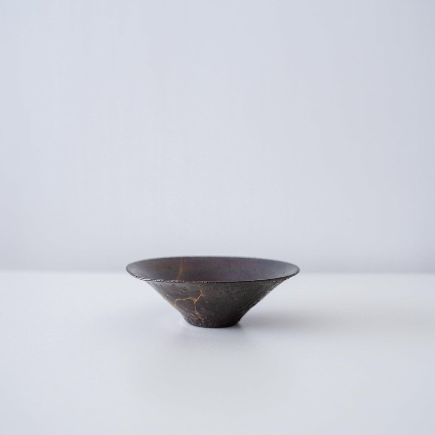 Side view of Kintsugi Bowl Purple Nebula 01 in a white background