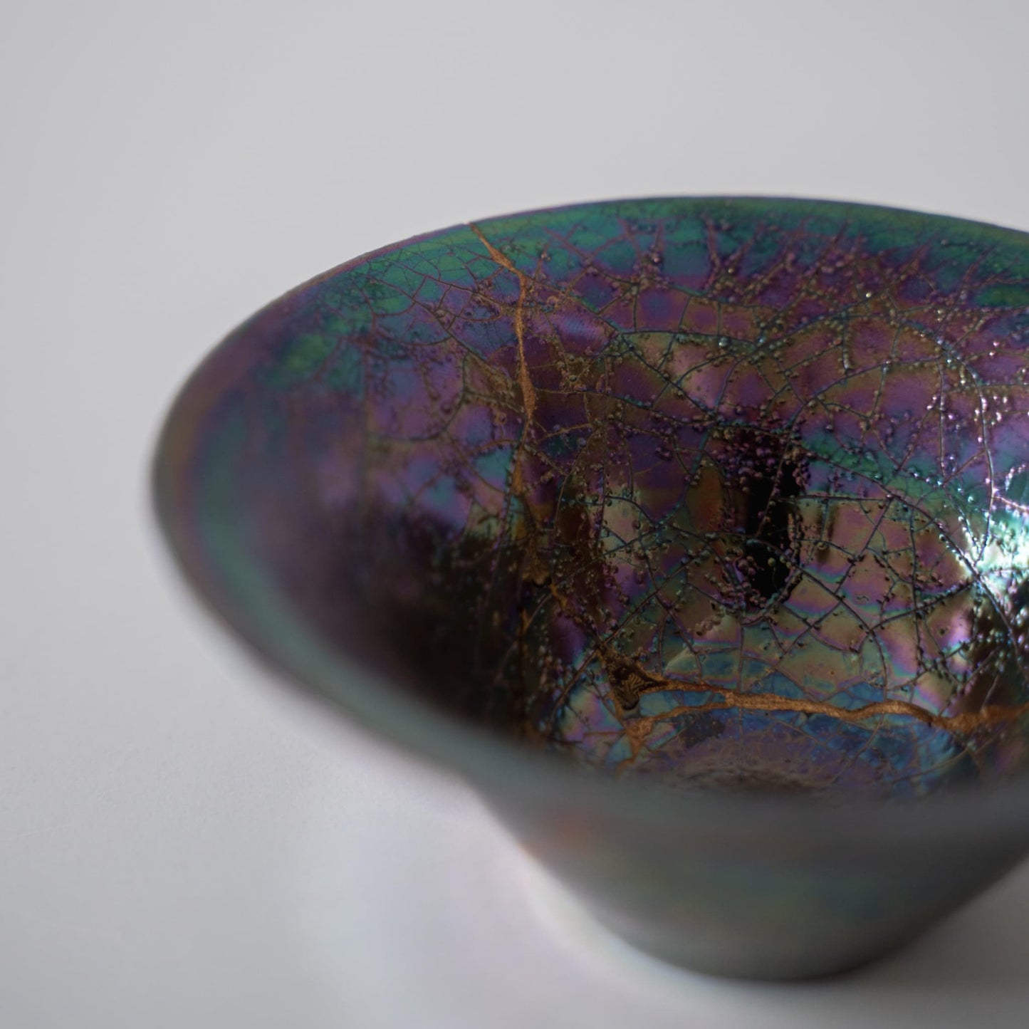 Close-up of Kintsugi Bowl "Rainbow Luster" side, highlighting the intricate Kintsugi repairs