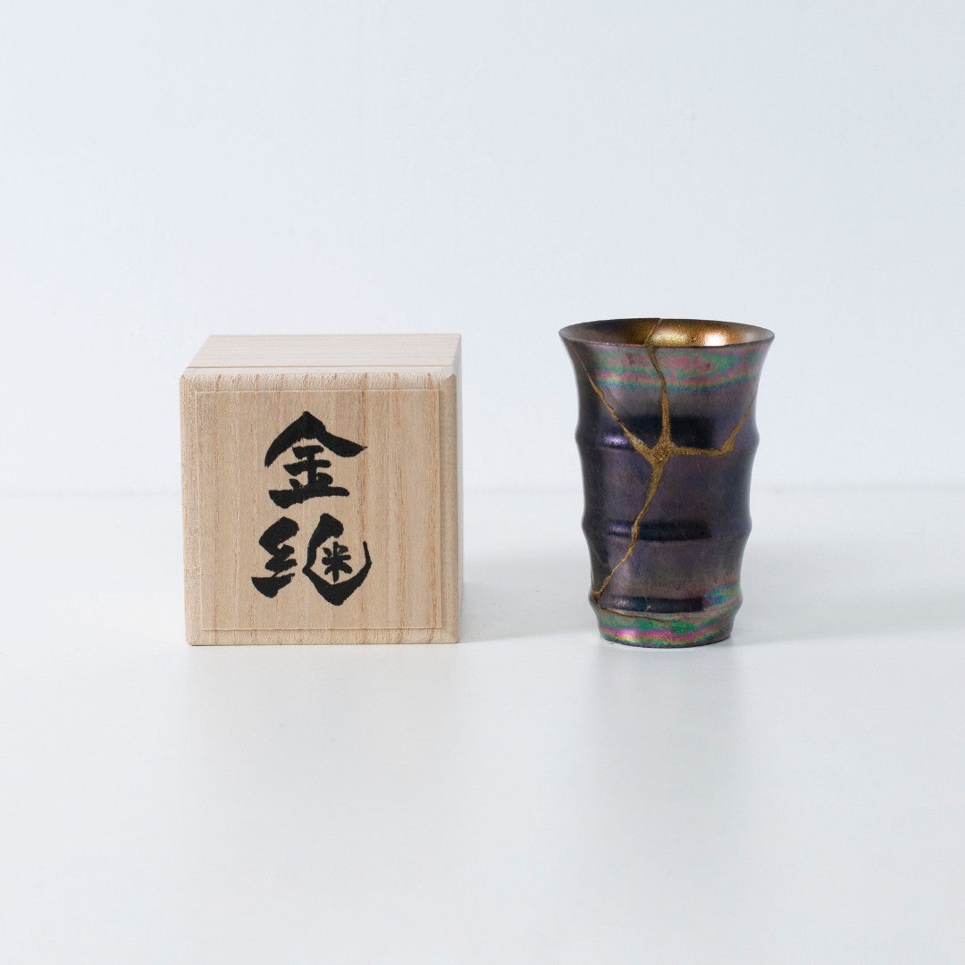 Magenta Luster kintsugi pottery cup with gold repair lines | wabi sabi bamboo-inspired design