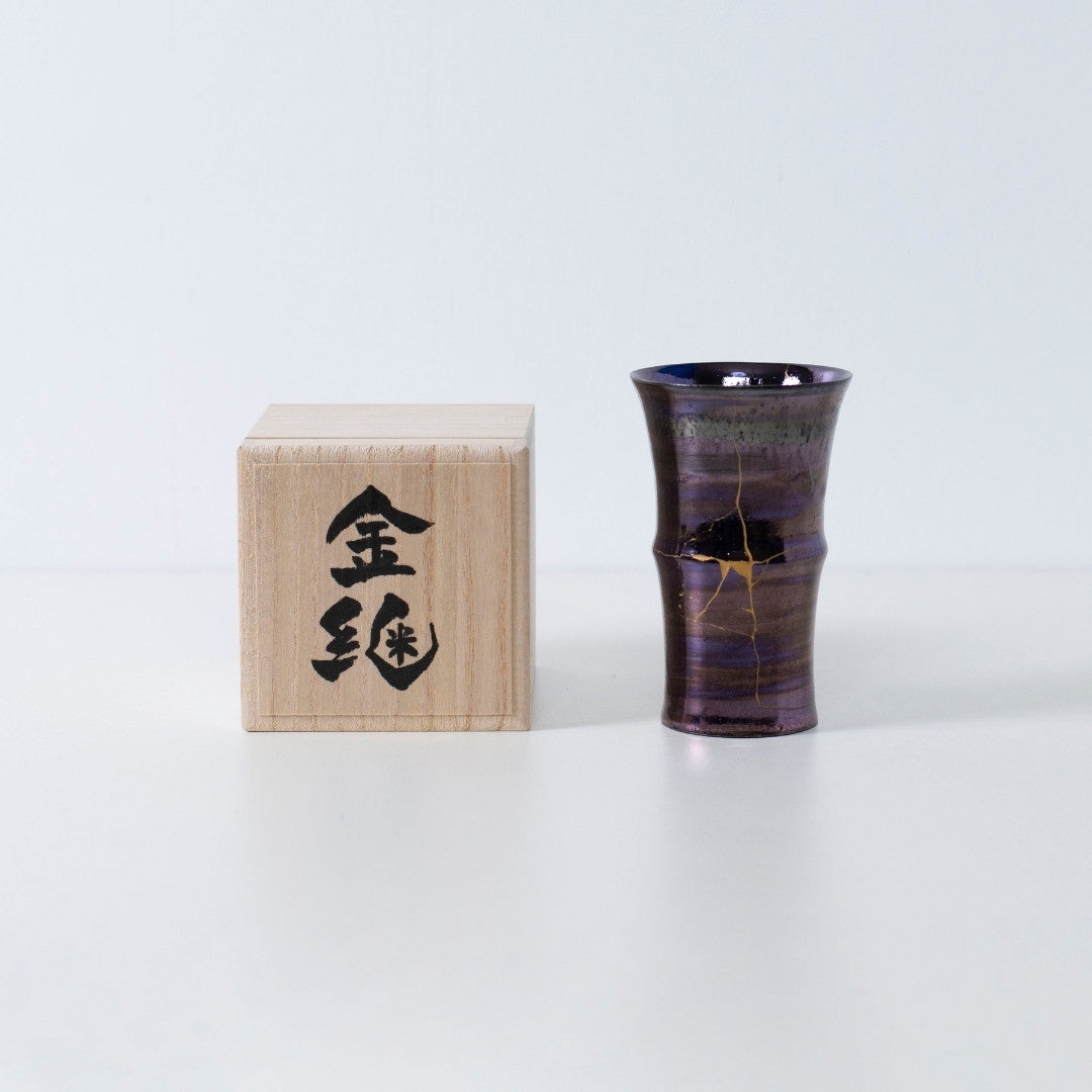 Kintsugi art cup in deep purple with golden cracks | wabi sabi pottery by Taku Nakano