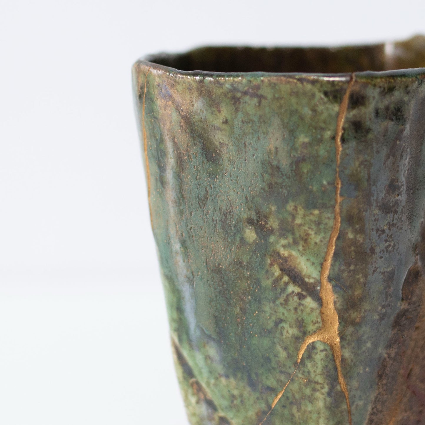Close-up of Kintsugi repair on Pentagon Kintsugi Cup "Oribe" Deep Green 01