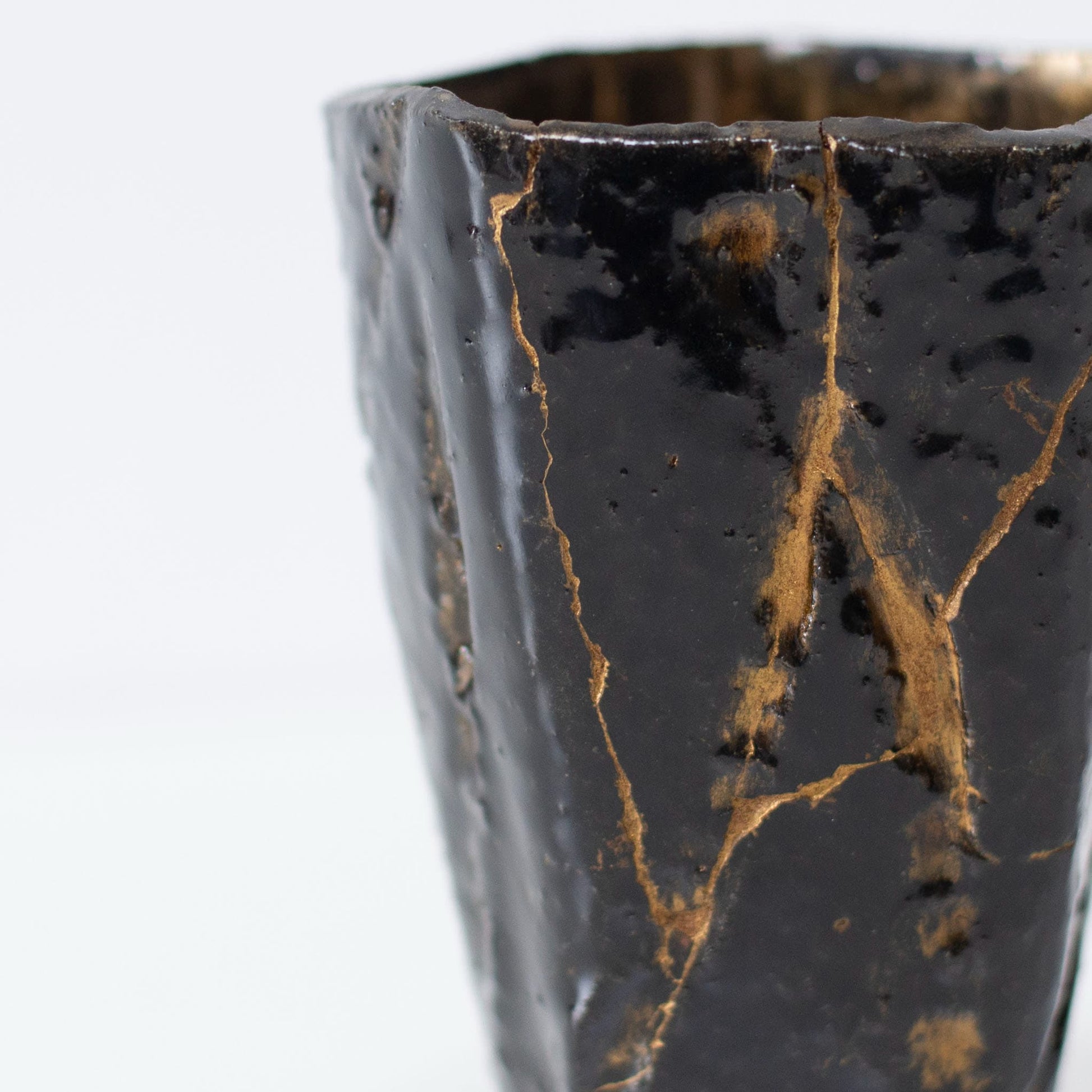Close-up of Kintsugi repair on Pentagon Kintsugi Cup "Tenmoku" Black 01