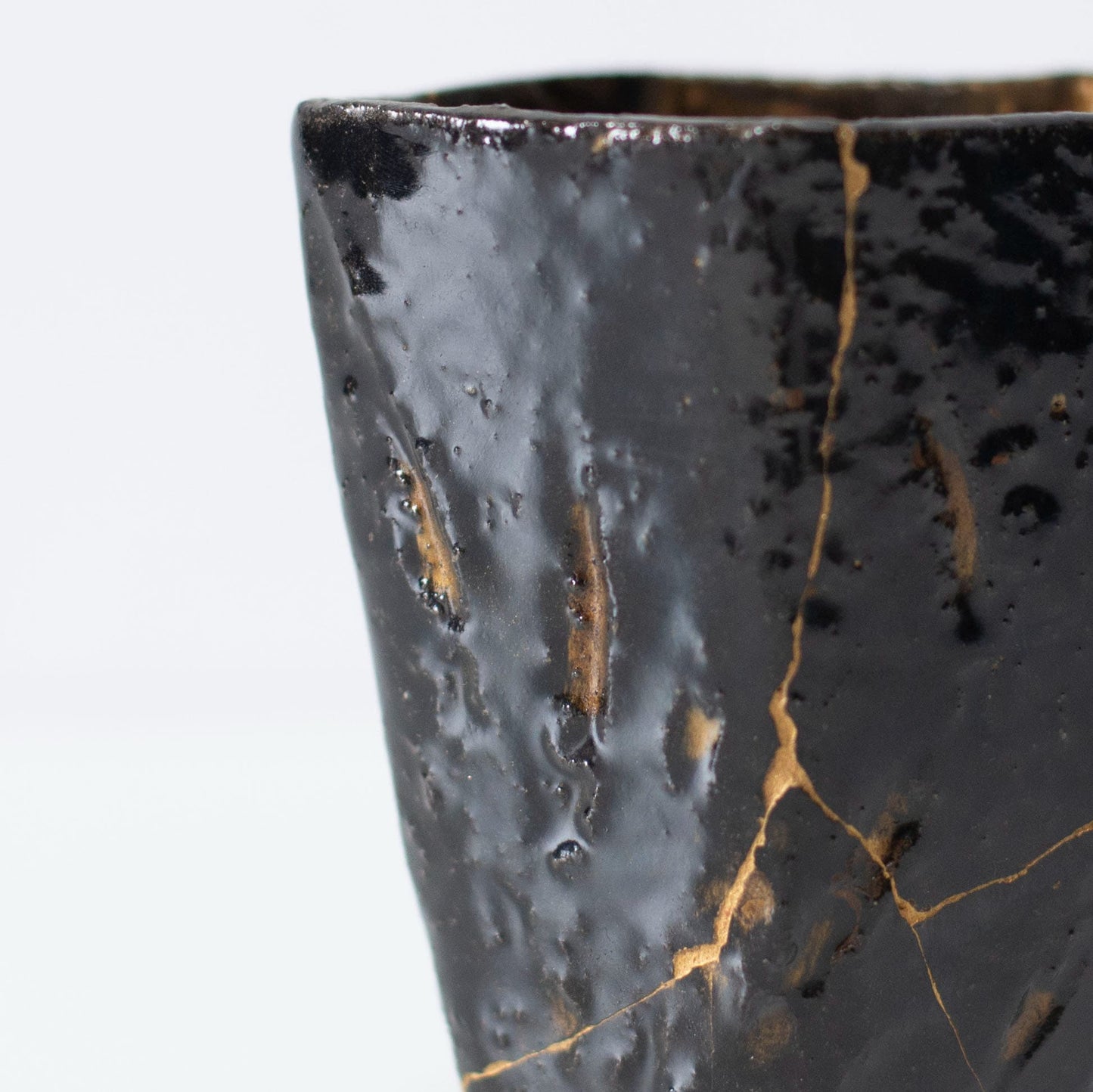 Close-up of Kintsugi repair on Pentagon Kintsugi Cup "Tenmoku" Black 02