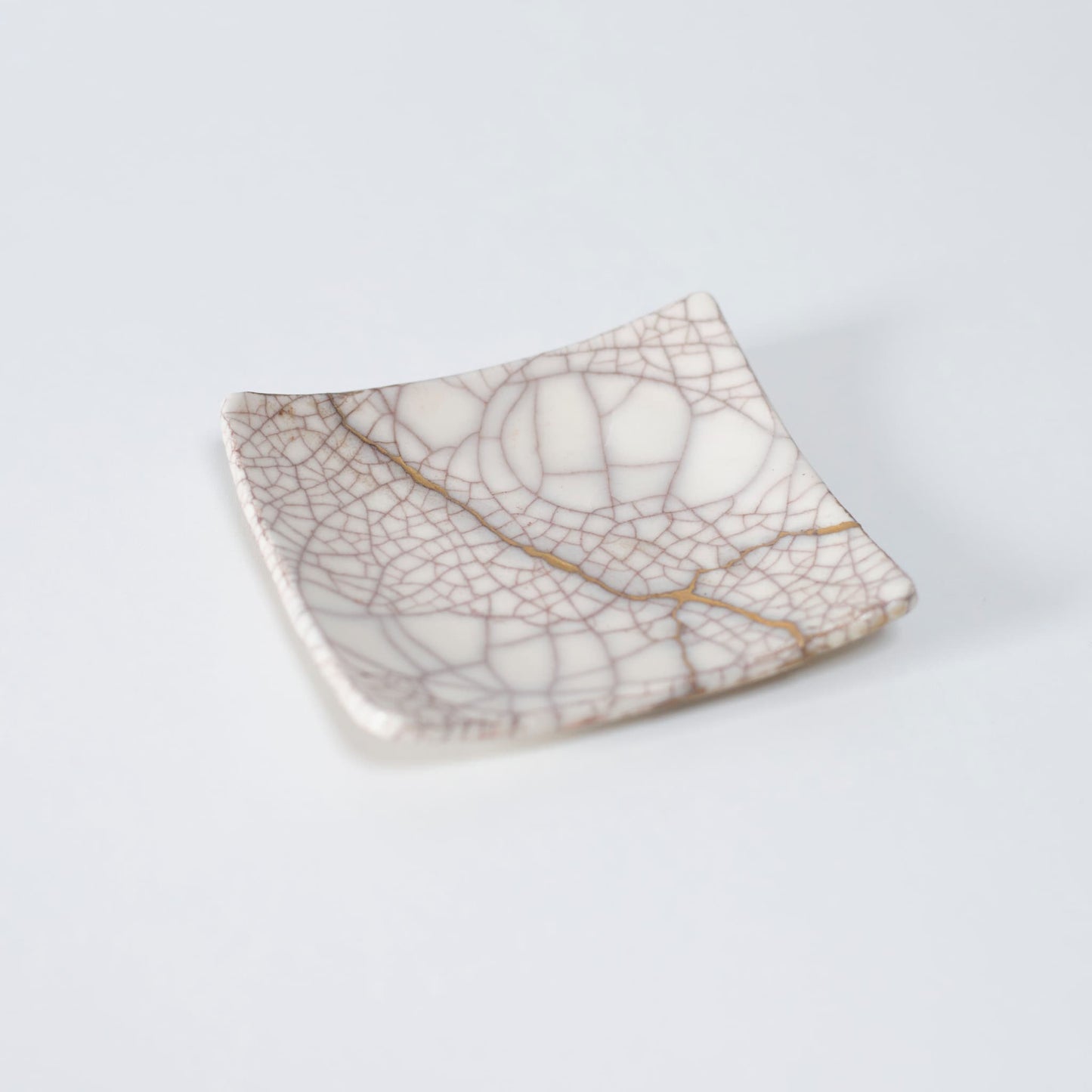 Top view of Kintsugi Square Plate "Vermilion Crackle" 01, showcasing its elegant design