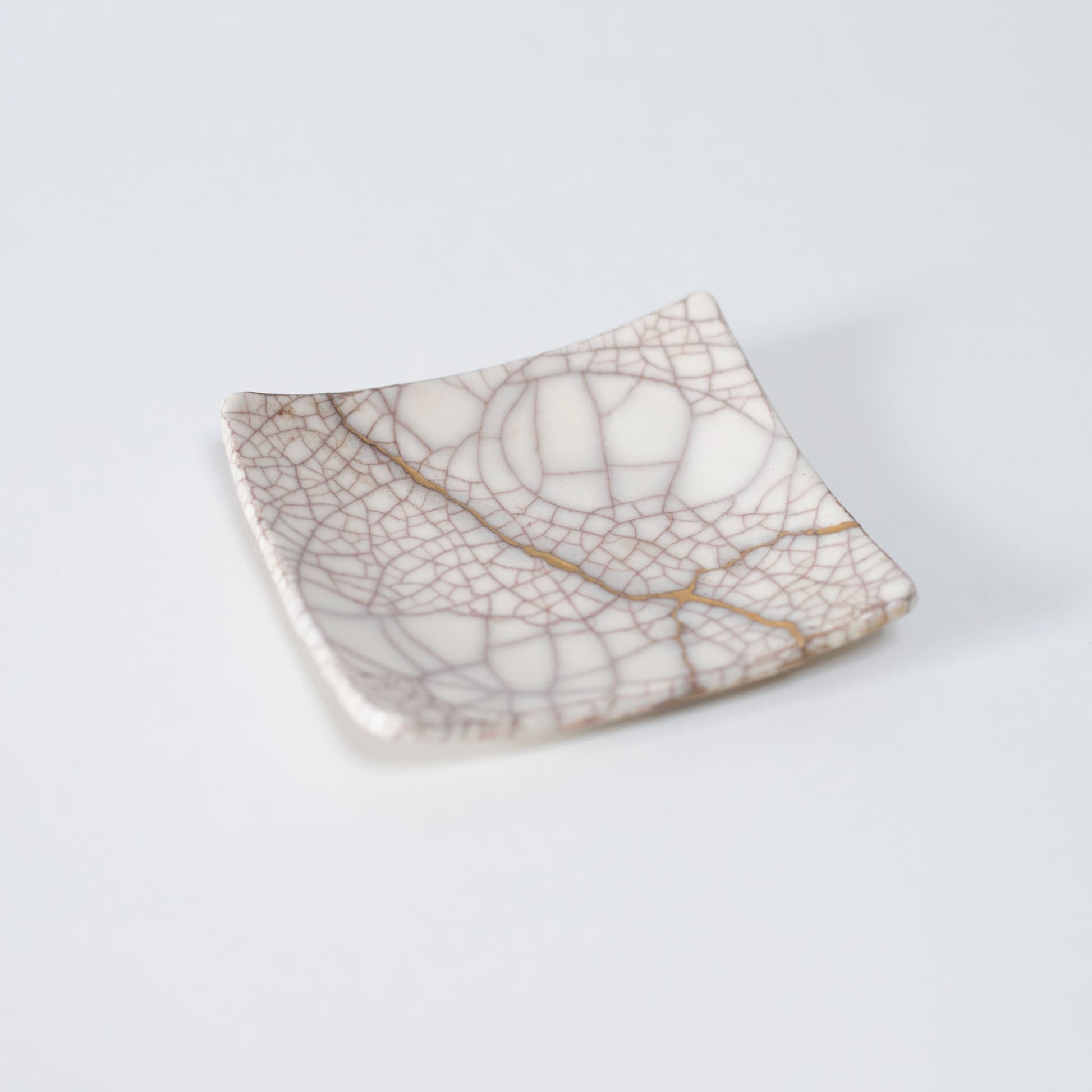 Top view of Kintsugi Square Plate "Vermilion Crackle" 01, showcasing its elegant design