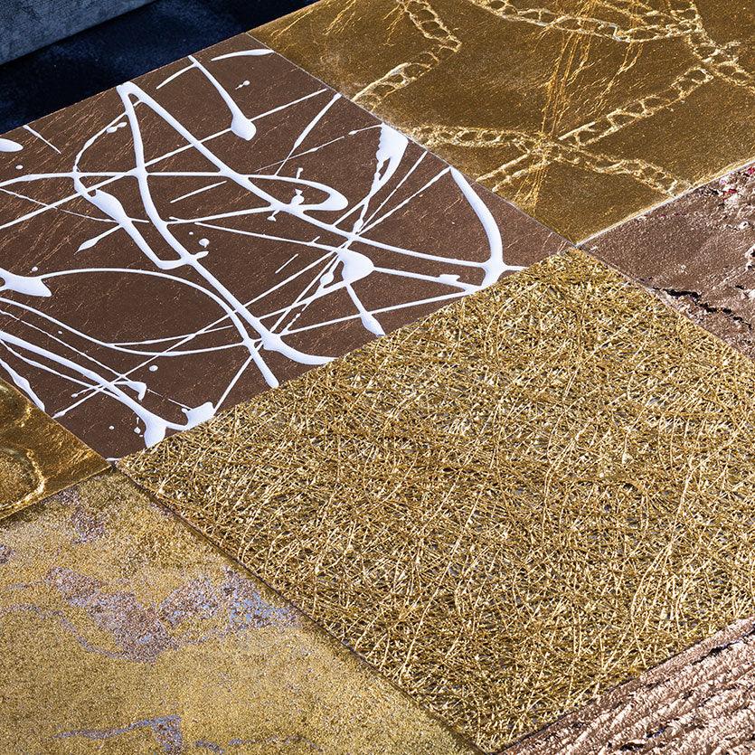 Detailed design of a gold leaf wall art composed of nine panels, each depicting a natural element.