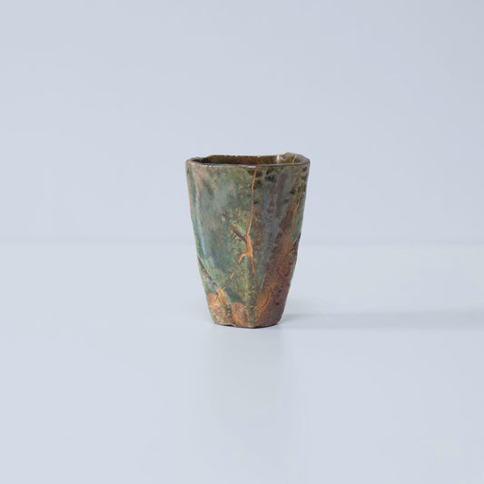 Side view of Pentagon Kintsugi Cup "Oribe" Deep Green 01 against white background