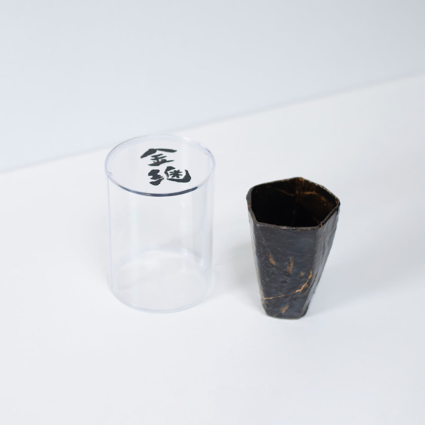 Pentagon Kintsugi Cup "Tenmoku" Black 02 in clear presentation case, top view