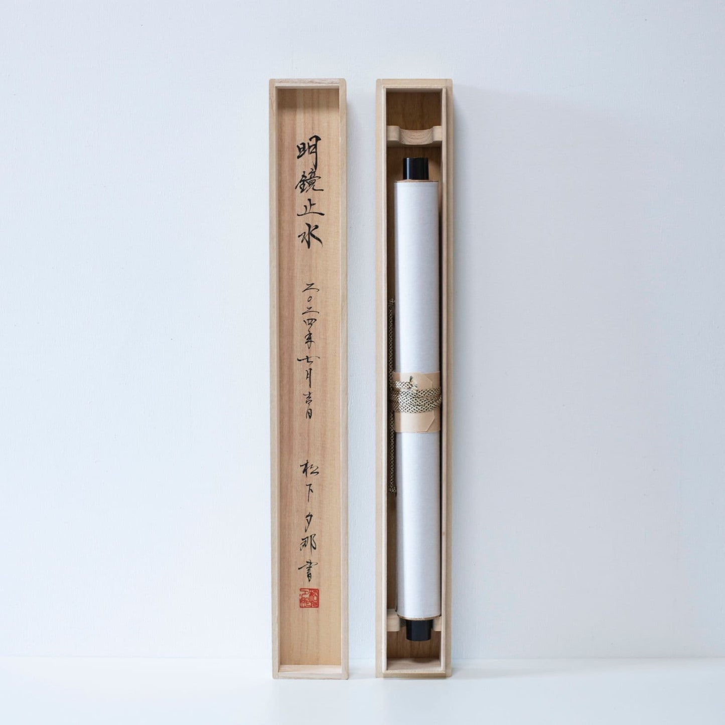 Japanese scroll stored in long wooden box with matching lid