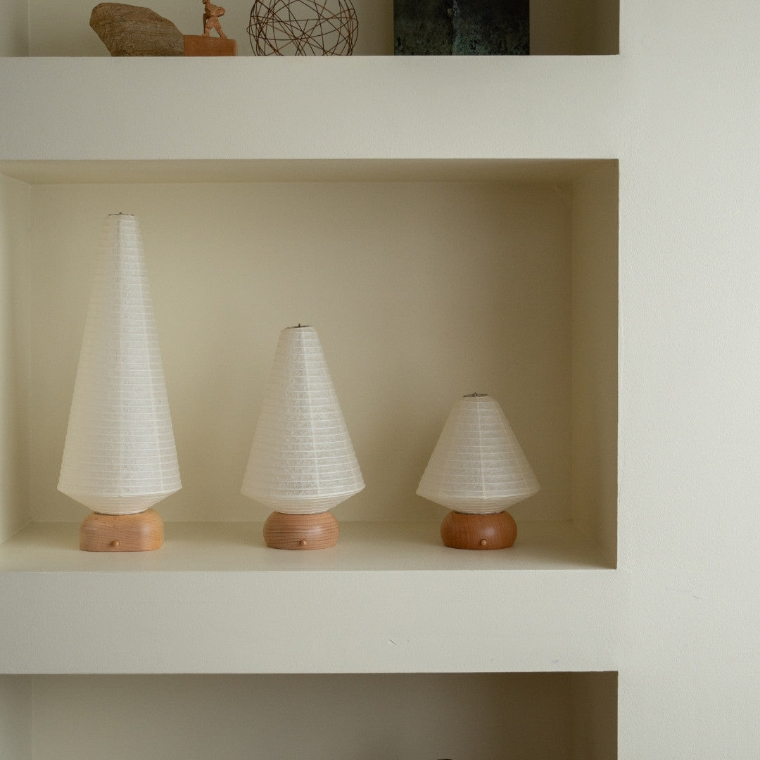 Three Japanese Paper Table Lamps on a white shelf in Japandi style room – unique table lamps for bedside tables