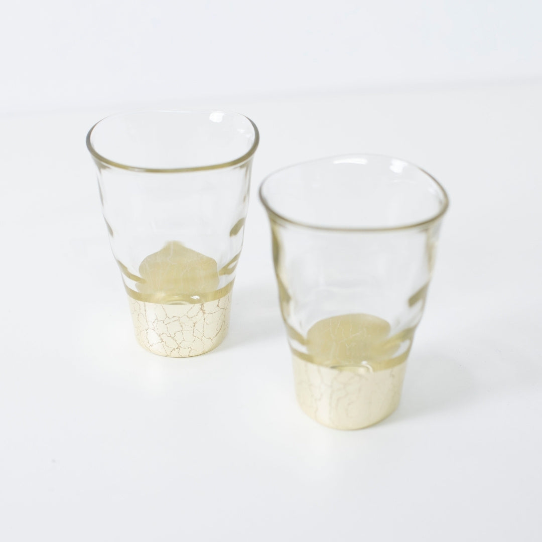 Top view of small champagne gold sake cup set, elegant Japanese sake glasses with leaf design