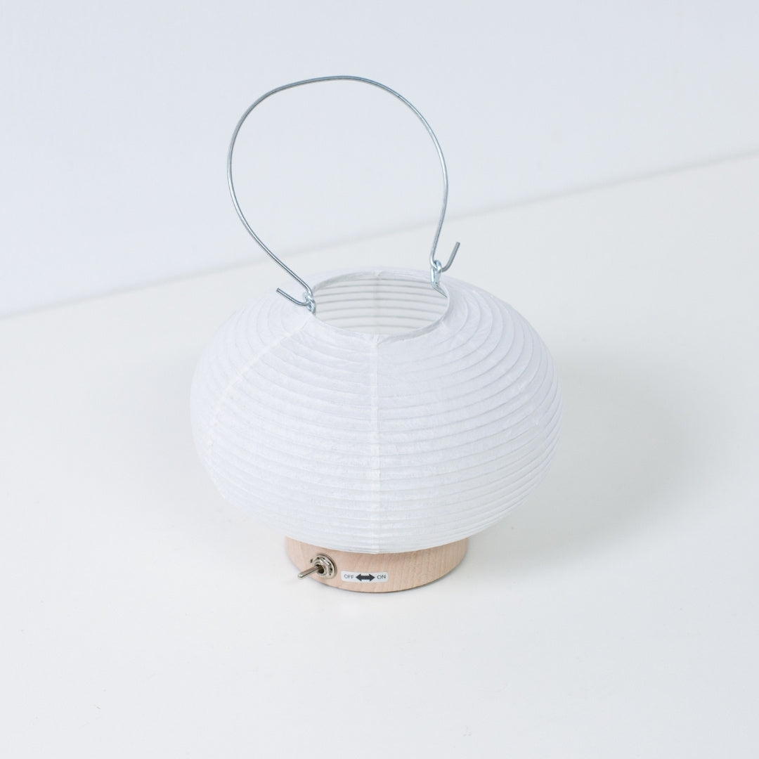 Top view of Japanese paper table lamp RIN 03, rounded portable Japanese table lamp design