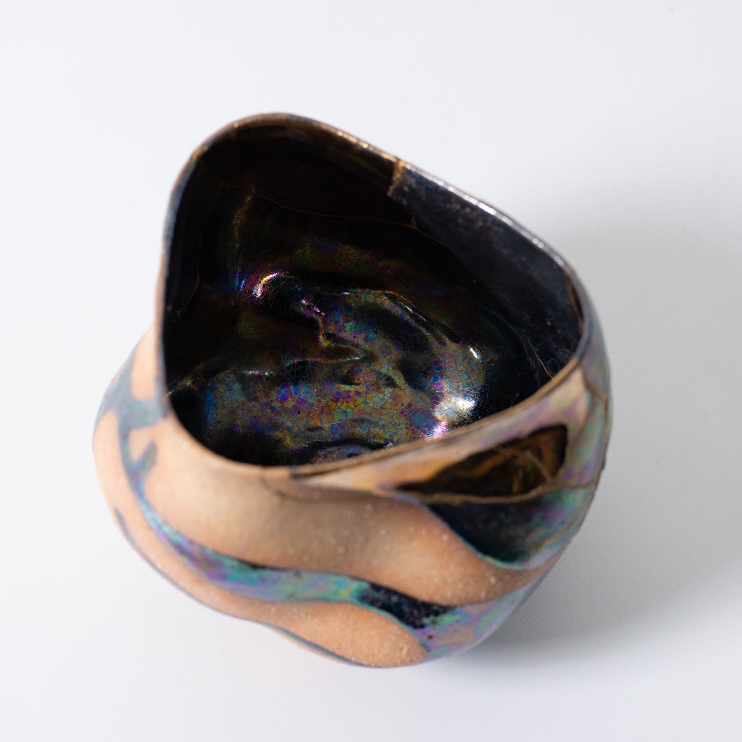 Top view of handcrafted Japanese kintsugi matcha bowl with shimmering gold seams