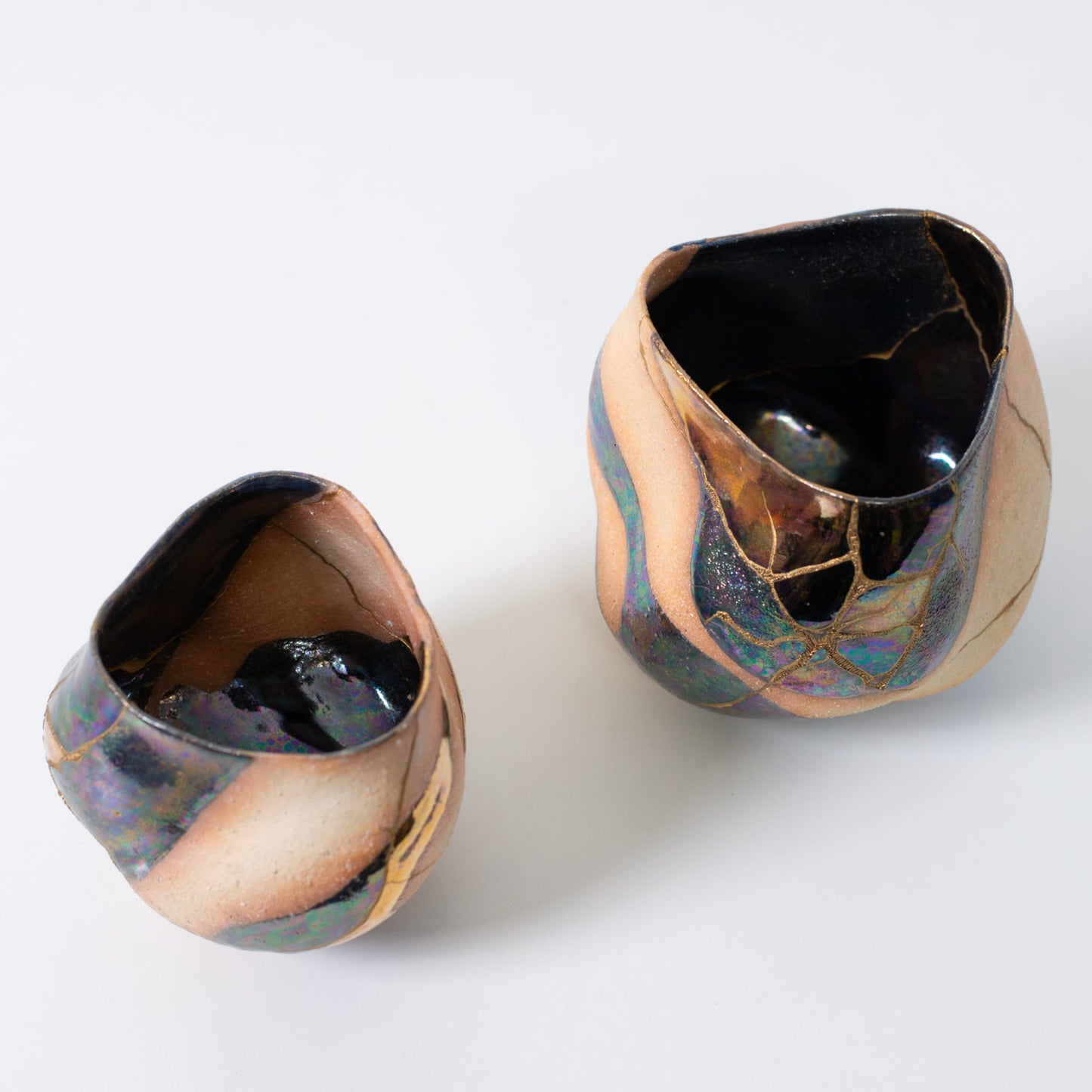 Two kintsugi matcha bowls showcasing Japanese pottery art and the beauty of imperfection
