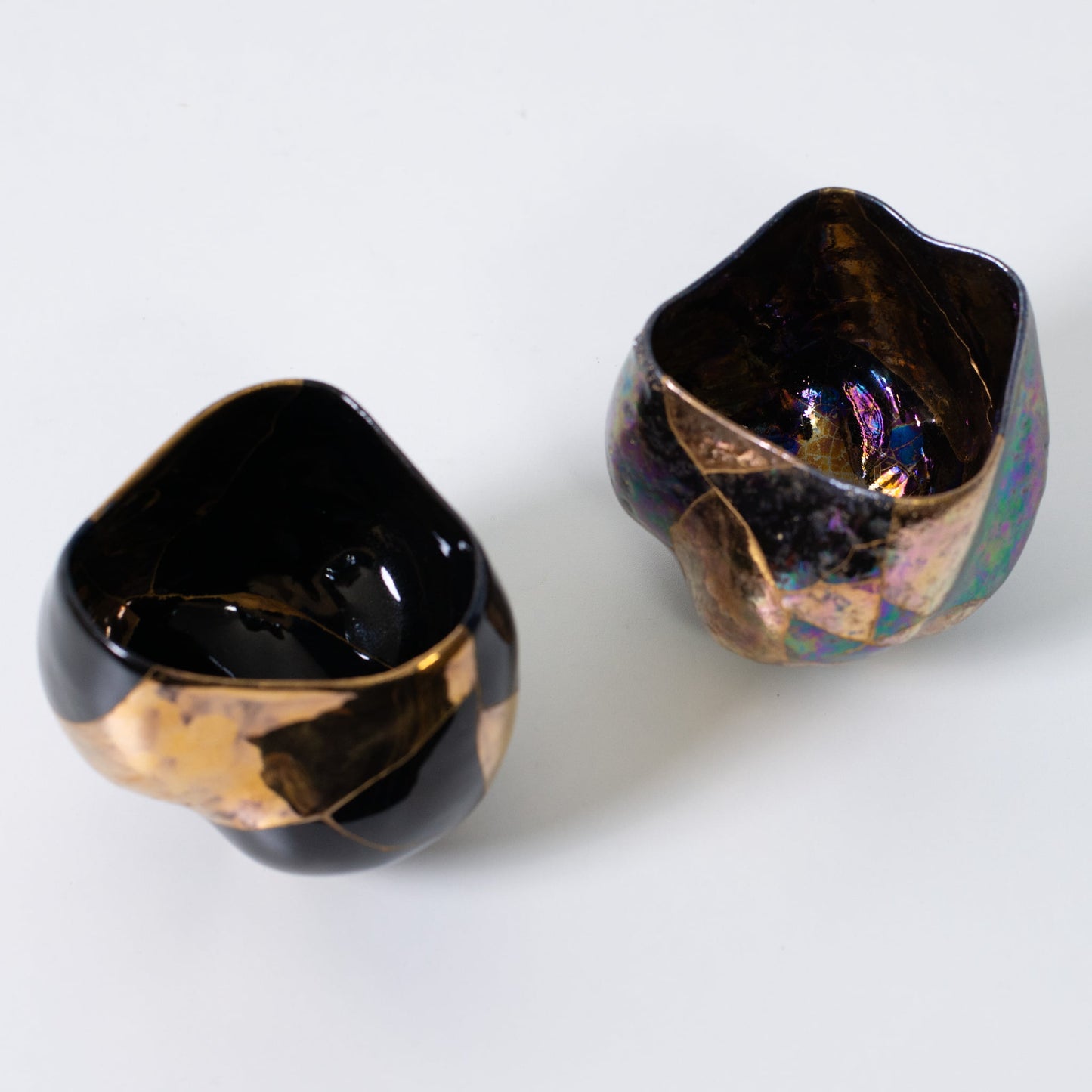 Two kintsugi matcha bowls showcasing Japanese pottery art and wabi-sabi design