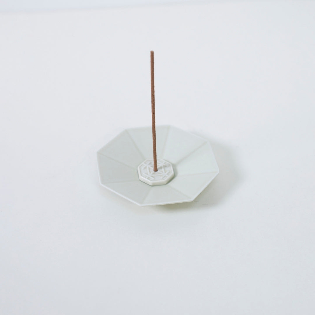 Top view of PORCELAIN INCENSE PLATE OCTAGON WHITE with incense stick - Japandi style incense holder with wabi-sabi