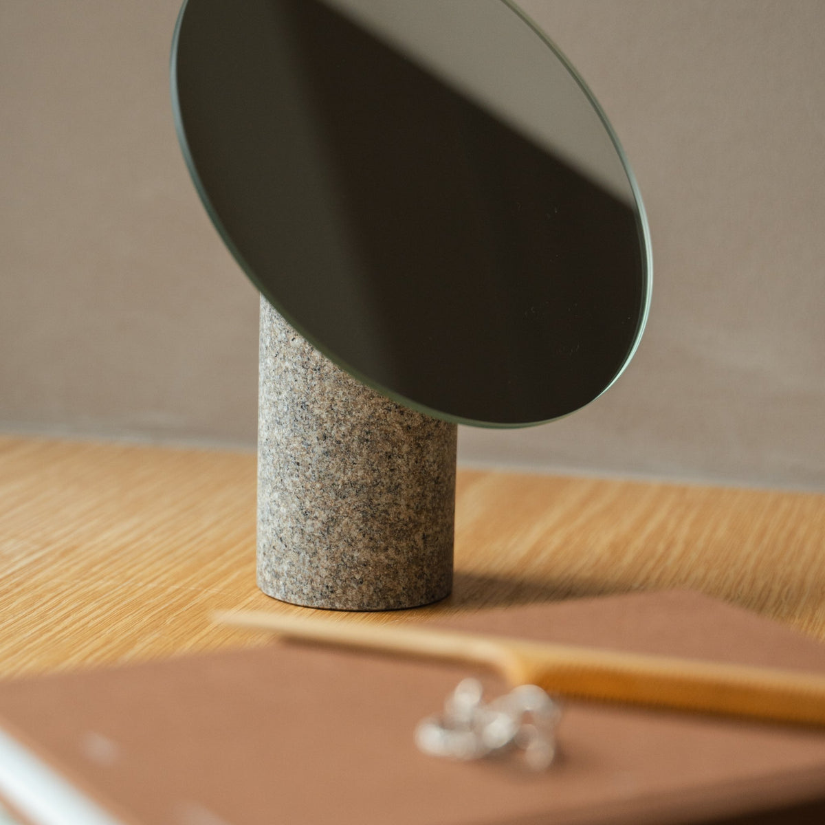 Japanese Aji Stone Table Mirror in natural stone styled in a styled room, detail lifestyle view.