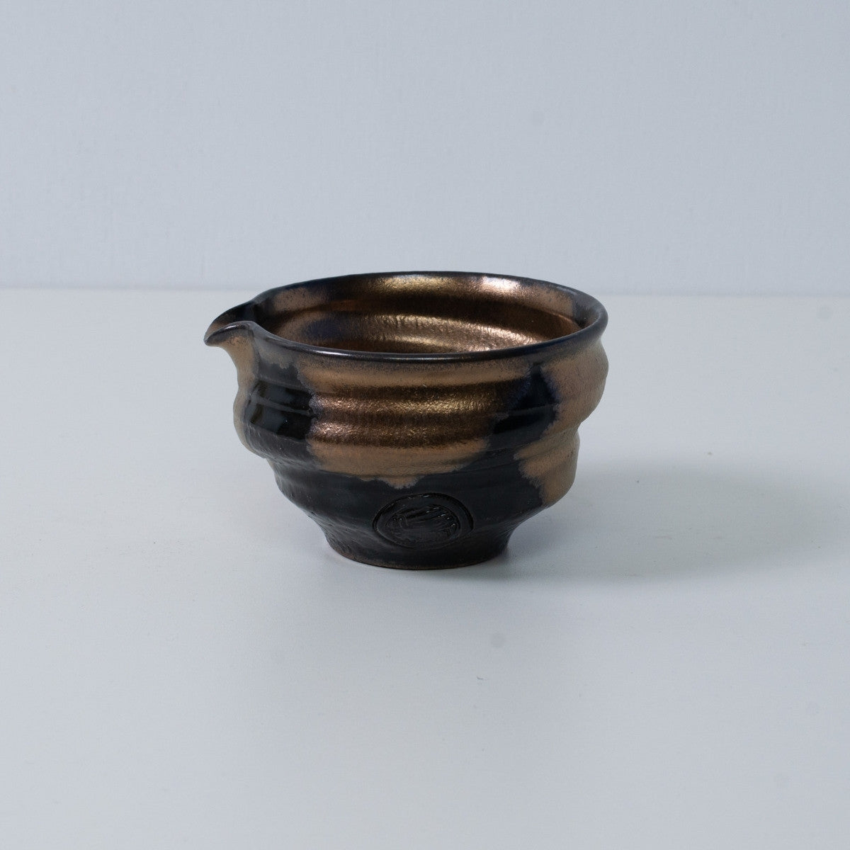Japanese matcha bowl with spout "Zen" pottery from Japan, featuring a gold and black glaze with an artisan seal.