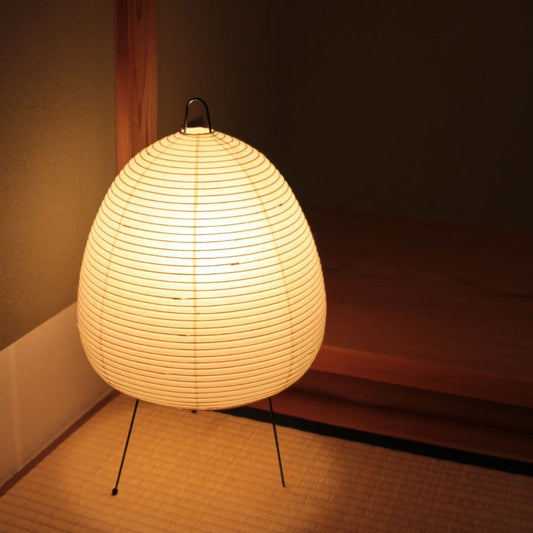 In the corner of the Japanese-style room, an Isamu Noguchi Akari lamp casts a soft glow around it.