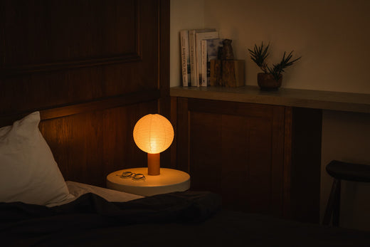 Japanese Paper Table Lamp "TORCHIN CIRCLE" on a bedside table