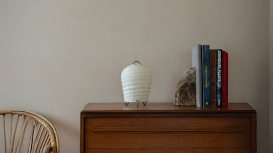 Japanese Paper Table Lamp "PAPERSON 01" on a wood table in Japandi room - Unique table lamps for living room & bedroom