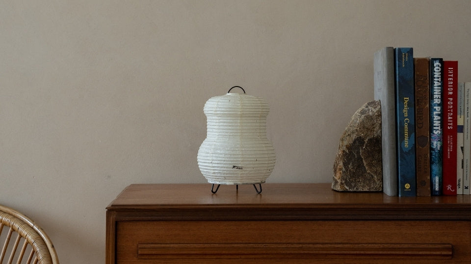 Japanese Paper Table Lamp "PAPERSON 03" on a wood table in Japandi room - Wabi-Sabi paper night lamp for bedroom