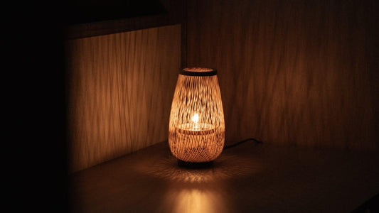Japanese Bamboo Table Lamp "Flower Bud" emits warm glow and shadows into a zen room