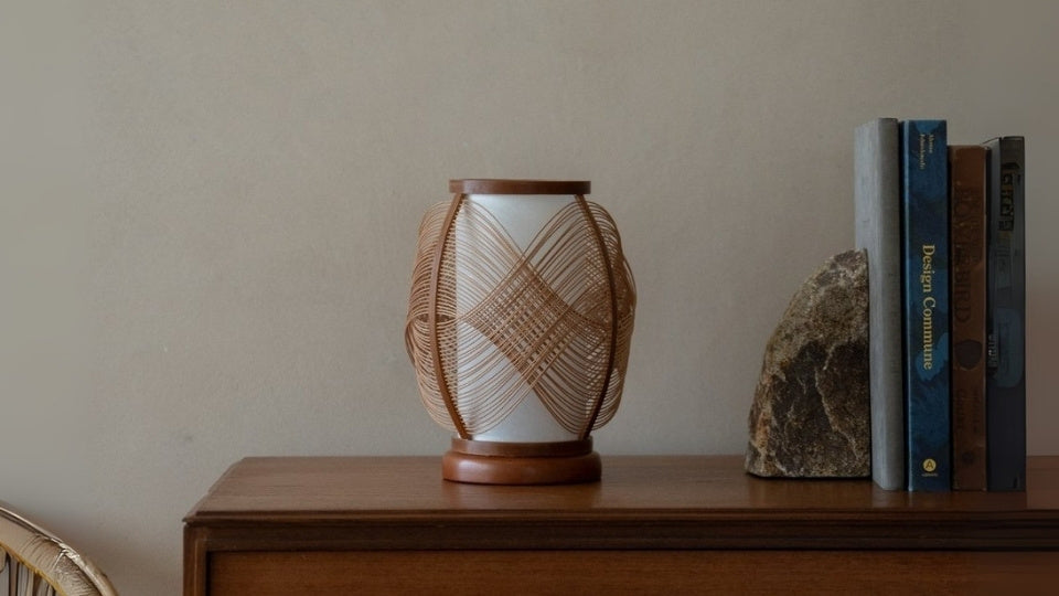 Japanese Bamboo shelf Lamp "Koyou" on a wood table in Japandi living room