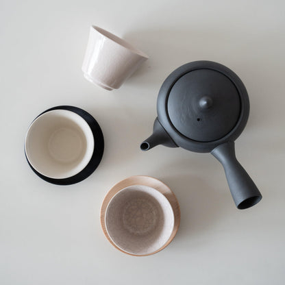 Japanese teacups and a black teapot