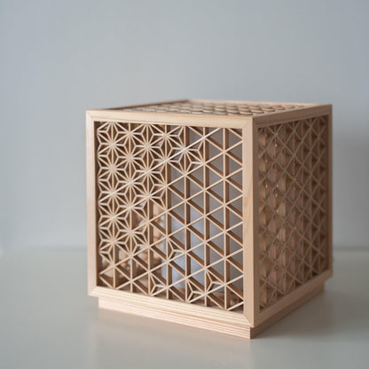 Japanese Kumiko floor lamp "Asanoha" on a white table
