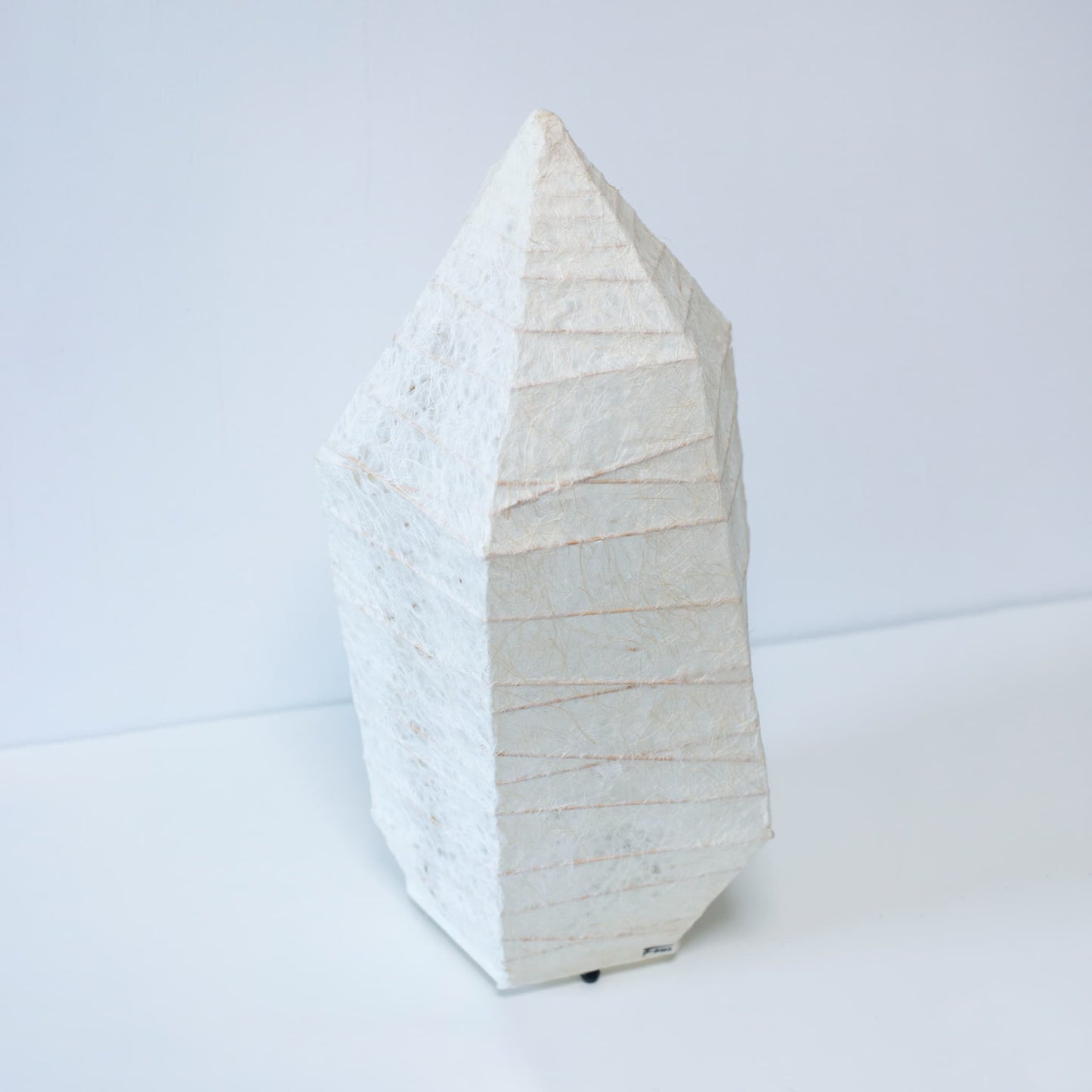 A Japanese paper floor lamp made with traditional washi paper and ice stone design.