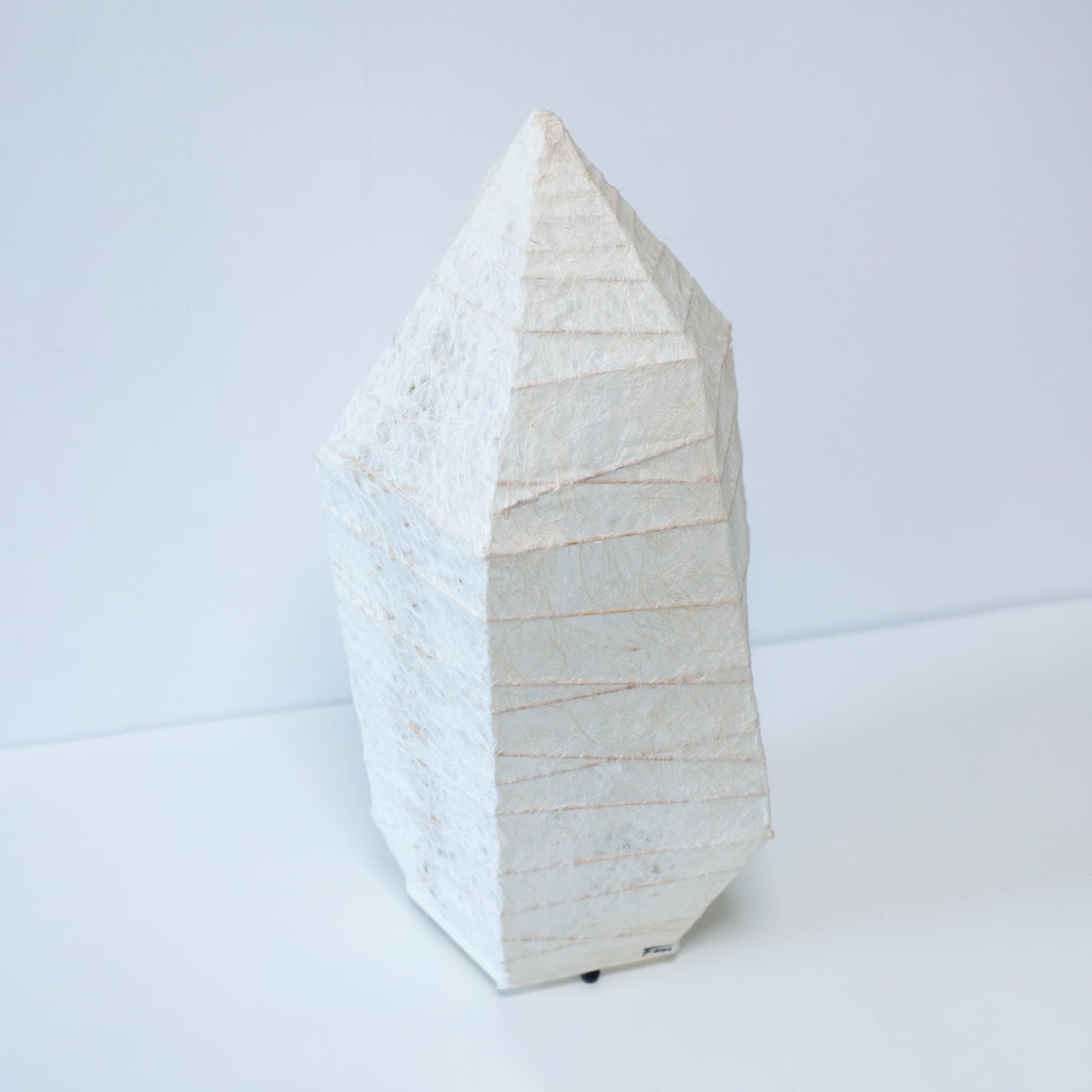A Japanese paper floor lamp made with traditional washi paper and ice stone design.