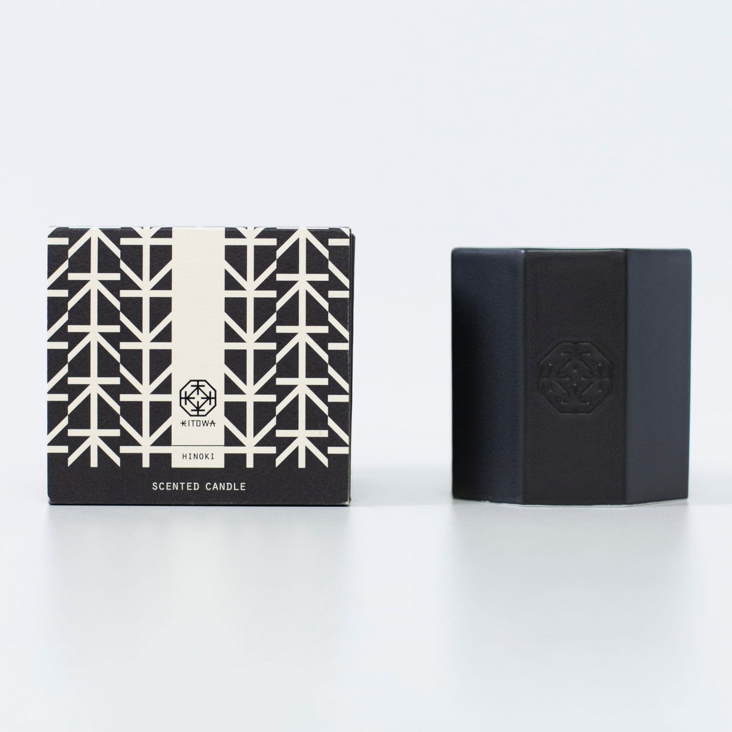 A Japanese black scented candle made of Arita ware, offering a relaxing wooden fragrance.