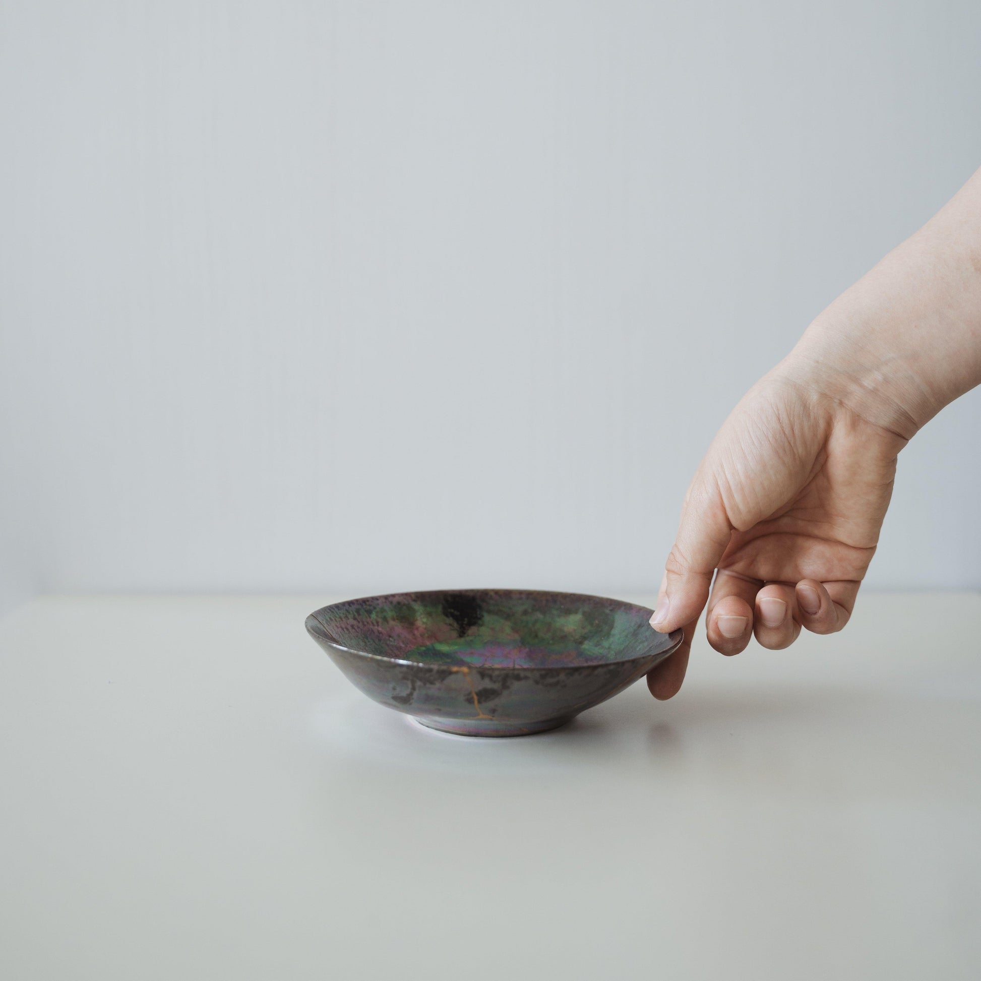 Bowl repaired with Kintsugi, a traditional Japanese technique that embraces the beauty of imperfection.