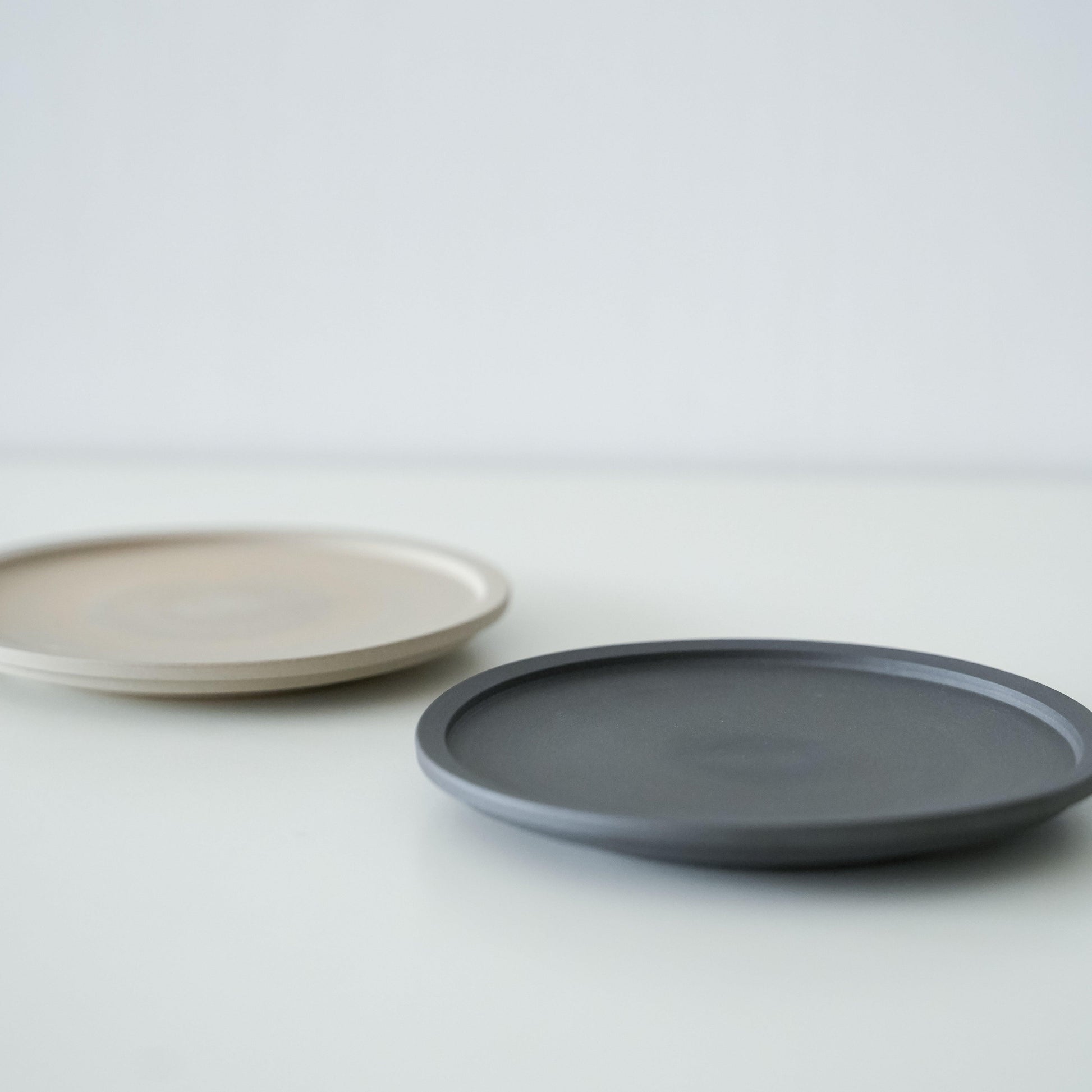 A set of simple black and white Banko ware plates.