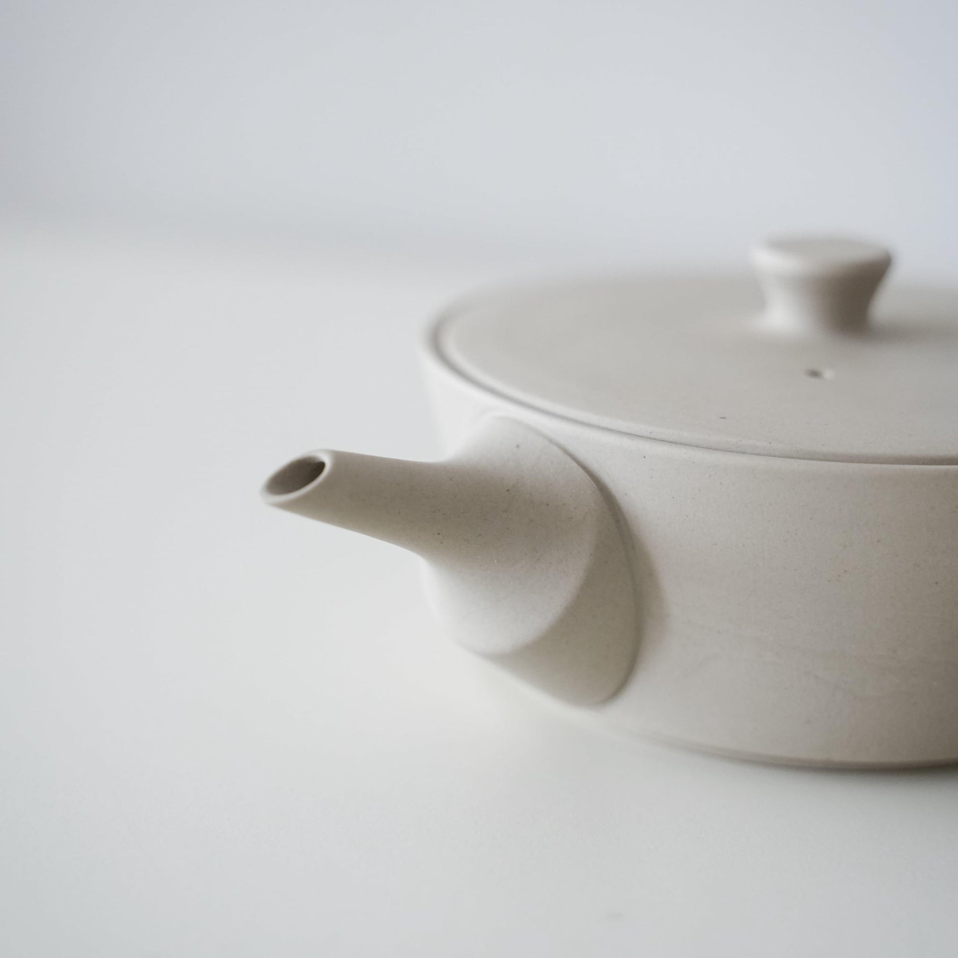 Pouring Spout of a White Japanese Sencha Teapot with Built-in Strainer