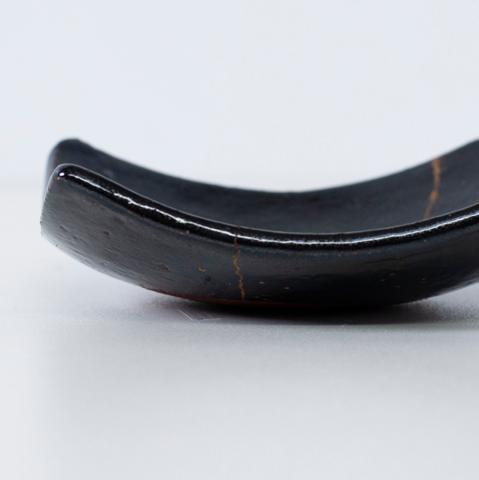 Close-up of the side profile of Kintsugi Square Plate "Jet Black Lighting" 02, highlighting the texture.