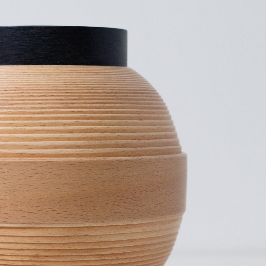 Close-up of wood light lamp made with BUNACO technique, showing fine beech grain and form.