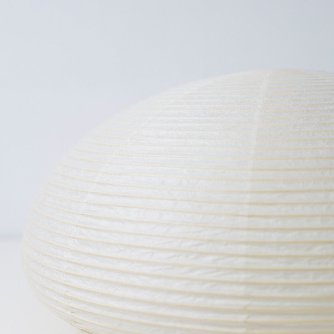 Close-up view of Japanese paper floor lamp "paper moon 04" – horizontal handcrafted Washi lamp