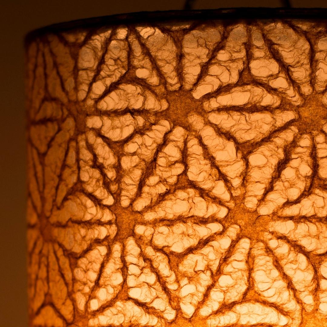 Rich brown lace texture highlighted on Japanese paper table lamp 'Lace Washi Brown' - unique bedside lamps for warm bedroom lighting