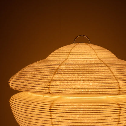 Close-up of glowing Japanese paper floor lamp GEMINI 01, warm Harusame washi Japanese lamp