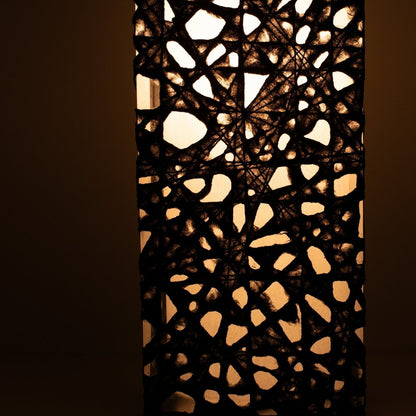 Close-up glowing black Japanese floor lamp ME-LOOK 01, intricate Melook washi paper
