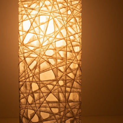 Close-up glowing white Japanese floor lamp ME-LOOK 01, intricate Melook washi paper