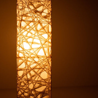 Close-up glowing white Japanese floor lamp ME-LOOK 02, intricate Melook washi paper shade