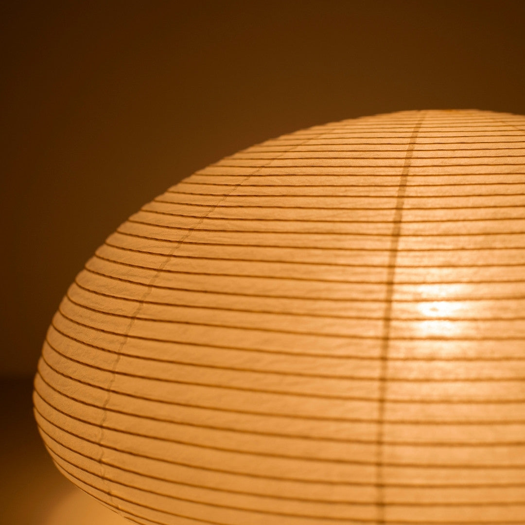 Close-up glowing Japanese paper floor lamp "paper moon 04" – tranquil horizontal Washi floor lamp