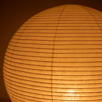 Close-up glowing Japanese paper floor lamp "paper moon 05" – luminous full moon Washi floor lamp
