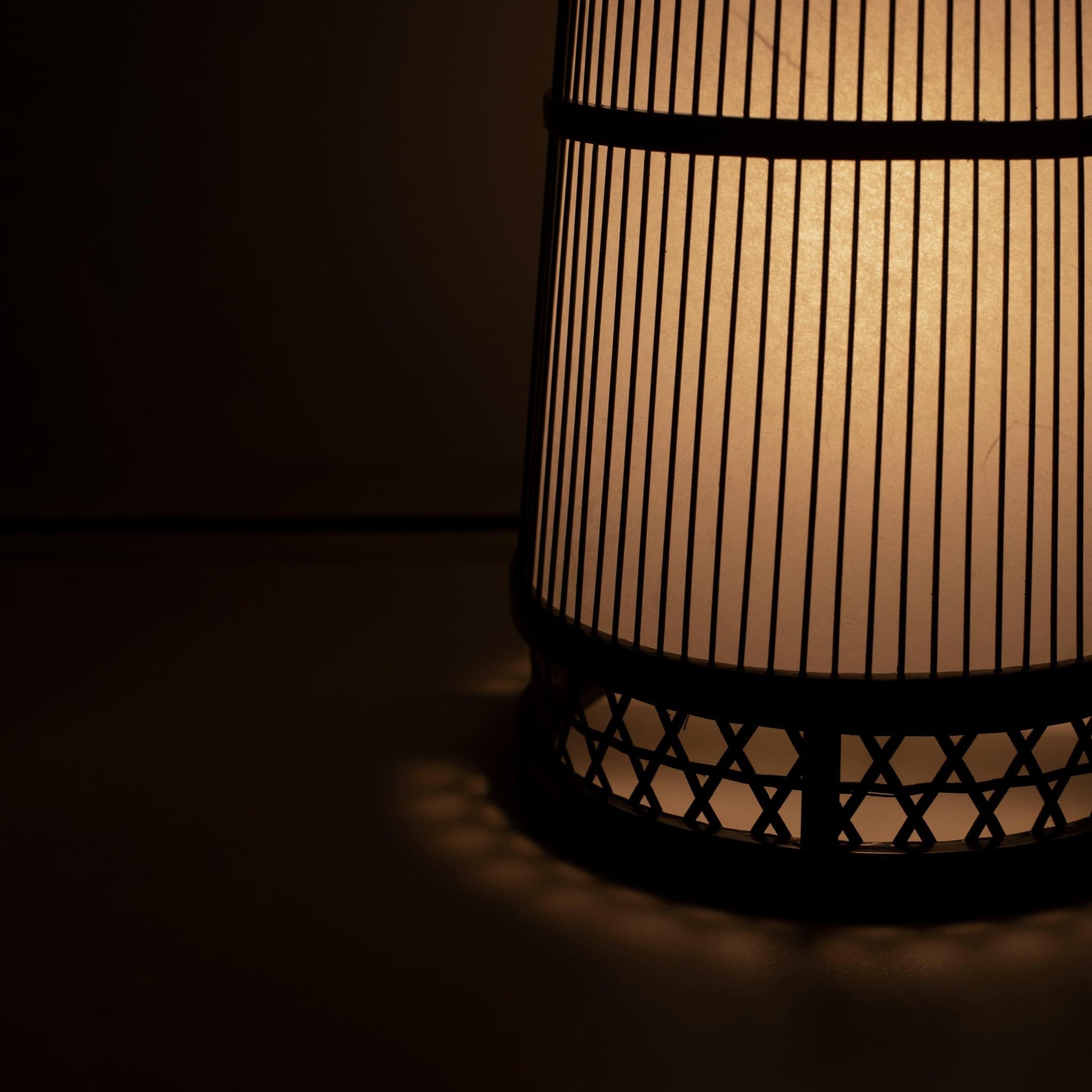 Exquisite Japanese lamp handcrafted with 800-year-old Shizuoka bamboo artistry. Delicate design casts a soft, warm glow.