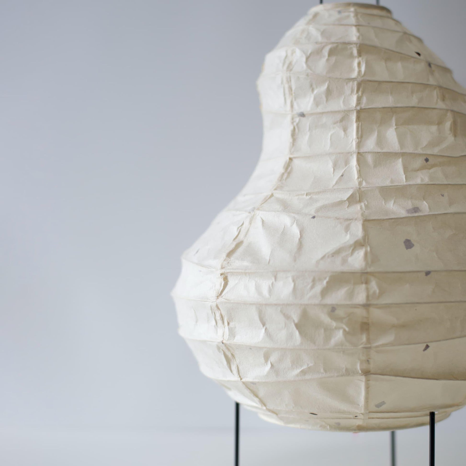 Detail of unique Japanese paper stand light, handcrafted with Gifu lantern techniques and traditional washi paper, showcasing a beautiful blend of heritage and modern design.