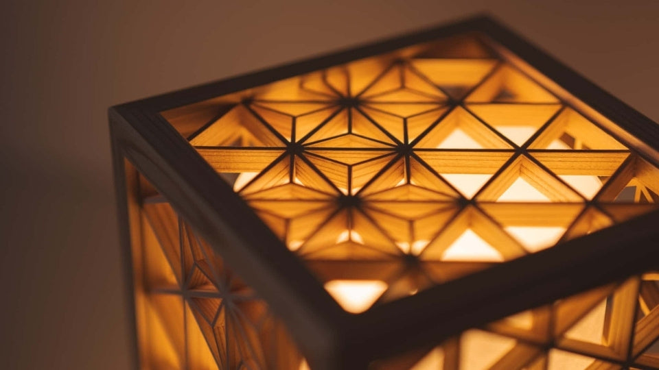 Kumiko lantern with traditional Japanese patterns emits a warm light
